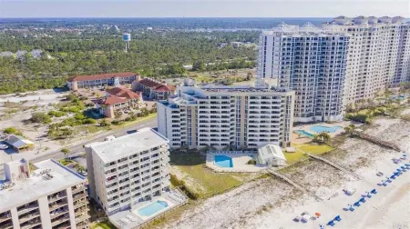 STUNNING 4TH FLOOR GULF FRONT CORNER UNIT with bunk beds