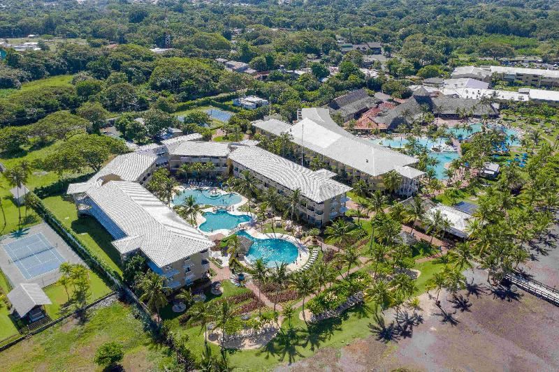 an aerial view of a large resort with multiple buildings , pools , and lush greenery surrounding the area at Fiesta Resort All Inclusive Central Pacific - Costa Rica