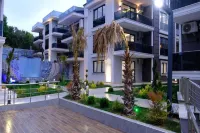 Flower City Suits Отели в г. Cinarcik