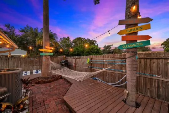 14 Guests · Large HEATED Pool · Tropical Backyard+BBQ · GYM · Beach: 3 miles