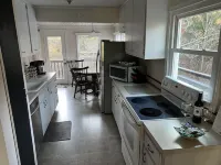 Cozy Cottage with access to and partially obstructed views of the bay.