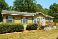 Mid-lake home conveniently located in quiet neighborhood with boat ramp.