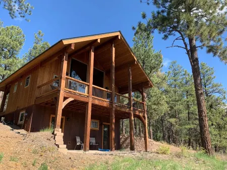 Nestled-in-pines, sooth-your-soul custom home with an incredible mountain view.