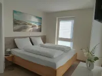 NEW! modern, high-quality, central apartment, with sauna, garden, wallbox in Burhave