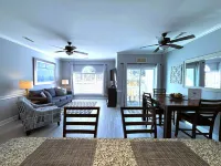 First Floor Updated Coastal Summer Retreat at Magnolia Place - Pool View