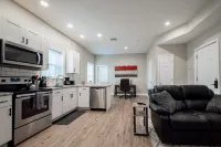 Exposed Brick and Modern Kitchen Amenities - Charming Historic Retreat