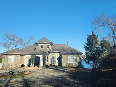 luxury living on Lake Anna! volleyball, outdoor kitchen, waterfront, firepit