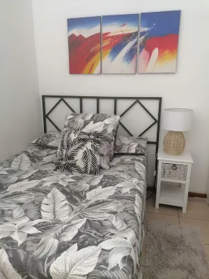 Cozy cottage for family getaway with private patio  and pool in safe suburb.