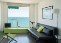 APARTMENT DESIGN 1 LINE BEACH WITH SWIMMING POOL, TENNIS COURT AND GARAGE. Hotels in Cullera