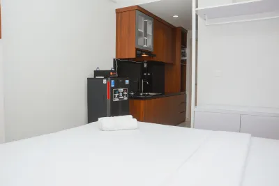 Comfy Studio Room at Patraland Urbano Apartment by Travelio