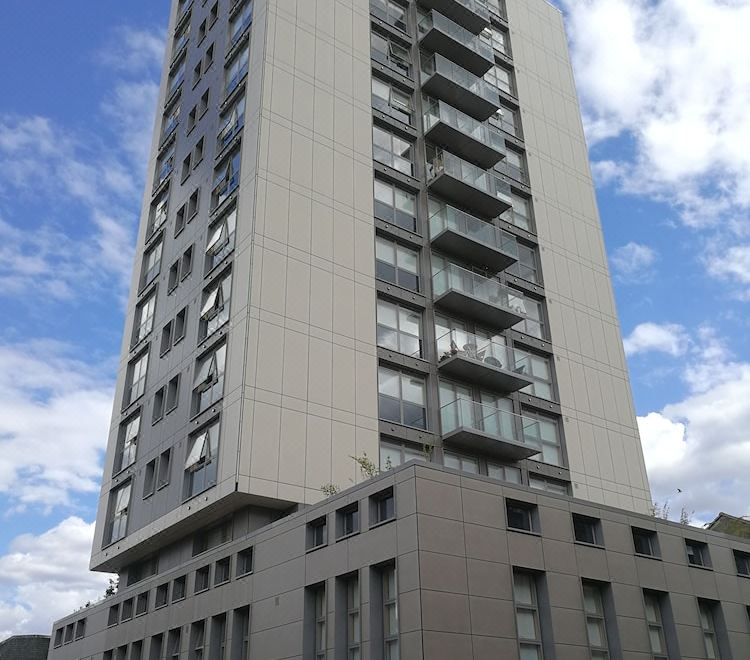 a tall , modern building with a gray exterior and balconies on the side of the building at Berkshire House