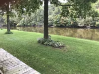 Muskegon River Cottage just steps from the river on a low bank.