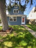 Charming Riverhead home with large outdoor patio & backyard  firepit