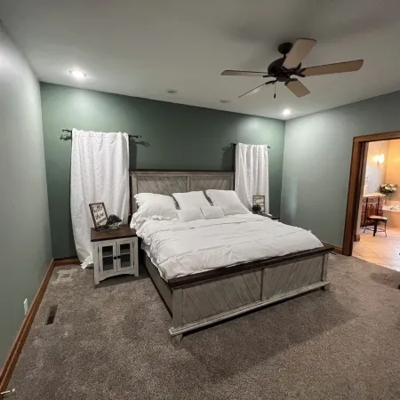 Fully custom modern four bedroom home on 13 acres with a stocked pond.