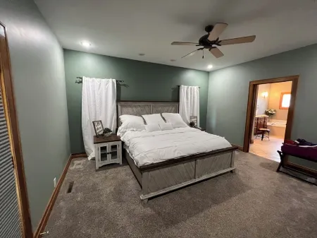 Fully custom modern four bedroom home on 13 acres with a stocked pond.