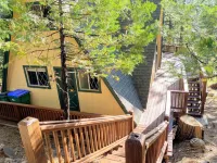 Private cabin in a small mountain town surrounded by pine trees. Snow getaway