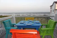 Just steps to the Sand & Surf!  Sleeps 12, with 2 Master Suites! Perfect Rental!