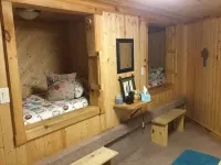 The Cardinal log cabin. Wrap around deck, firepit. Next to Pipestem resort park.