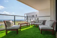 Vibrant Seaside Stay with Balcony by Sea N' Rent