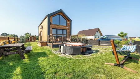 Domek Freedom Sun & Snow with Sauna and Jacuzzi Отели в г. Волин