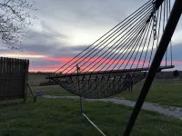 King bed in Tulip Glamping Aframe at Noble Pine Campground