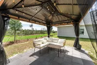 Beach House with Golf Cart, Grill & Two Pools!