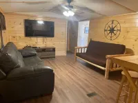 3BR, 2 Bath Cabin with full kitchen, living room, and hot tub.