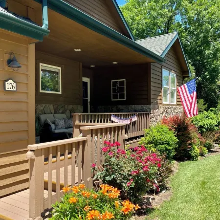 Nestled by the 7th green, large deck areas. Movie theatre for inside or out.