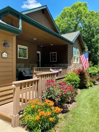 Nestled by the 7th green, large deck areas. Movie theatre for inside or out.
