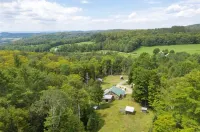 Sun drenched cozy cottage on budding 17 acre homestead
