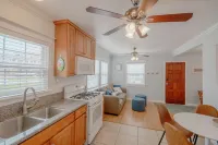 Across quiet street from sandy beach.