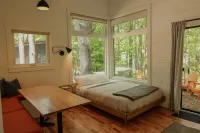 Serene Outdoor Seating and Modern Amenities - Luxurious Enchanting Cabin