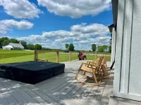 Eagles Crossing is a Newly Renovated 3-Bed Farmhouse with a Large Deck & Hot Tub