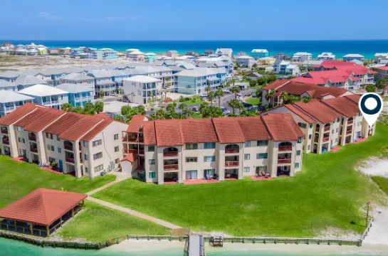 Sound-view beach condo with private balcony, pool, grills, central AC, & W/D