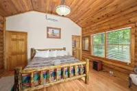 Enchanting 5-Bed/5-Bath Lakefront Log Cabin with Private Cove, Beach & Hot Tub.