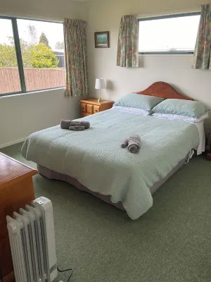 Corena's Place - walking distance to lake and town.  Includes linen and wifi.
