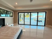 Riverfront 5 bedrooms, 5 baths , pool , spa , beach , dock and stunning views !