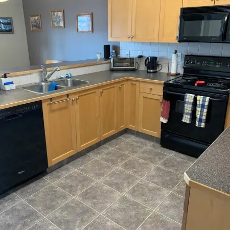Spacious 4-bedroom townhome in charming Red Deer with WiFi, AC