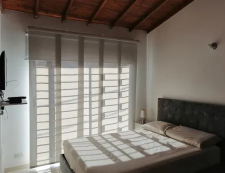 Casa cerca al Aerpuerto  y hospital San VicenteCozy House close to the Airport. Отели в г. Рионегро