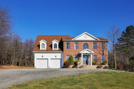 Spacious 6-bedroom Pocono Home with Hot Tub, Game and Theater rooms, Fire Pit!