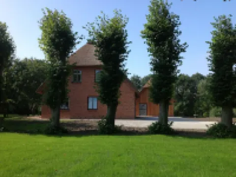 Cottage on park-like grounds with pond