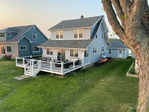 Enjoy Beautiful Sunsets at this Lake House w a HOT TUB, Boat Garage and Game Rm