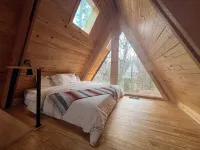 Modern lakefront cabin nestled in the piney woods of East Texas. Pet Friendly!