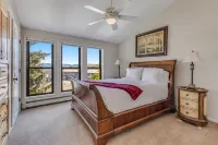 Seconds to mall and slope, 2 hot tubs,1 pool, small gym, fireplaces