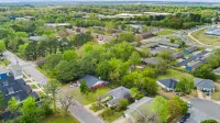 Backyard Fire Pit, Game Area and Cozy Seating - Charming Oasis Hotels in Fayetteville