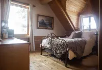 Hébergement "La Maison en Bois Rond" Hôtels à : Sainte-Marie