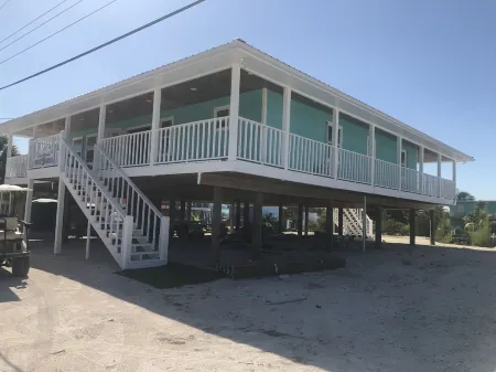 NEW RENTAL!!! Conch Heaven is a four bedroom house on a canal with a dock.