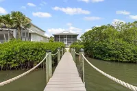 Private Bayfront Beach House w/ Dock & Spa, Steps to Beach and Restaurants