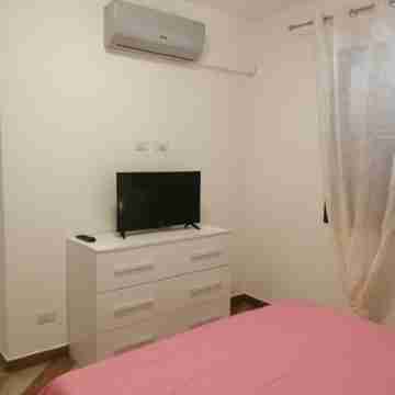 Appartamento Indipendente in Villa con Piscina e Accesso Privato Alla Spiaggia Rooms