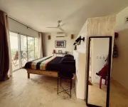 Luxurious villa set in a vast tropical garden, with panoramic sea and nature views.